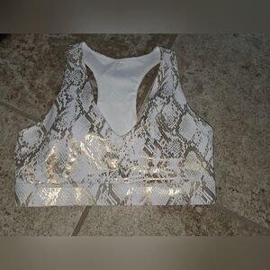 Fabletics On-The-Go Midi Medium Impact Sports Bra- Gold Foil